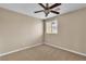 Cozy bedroom with a ceiling fan and a bright window offering natural light at 2376 Via Firenze, Henderson, NV 89044