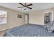 Relaxing bedroom with neutral walls, plush carpet, and a ceiling fan at 2376 Via Firenze, Henderson, NV 89044
