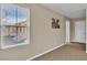 Cozy bedroom featuring carpet flooring and a window letting in plenty of sunlight at 2376 Via Firenze, Henderson, NV 89044