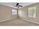 Bright bedroom with neutral walls, a ceiling fan, and window providing natural light at 2376 Via Firenze, Henderson, NV 89044