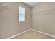 Walk in closet with wire shelving and natural light from the window at 2376 Via Firenze, Henderson, NV 89044