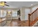 Welcoming entryway with natural light, a stylish console table, and stairs at 2376 Via Firenze, Henderson, NV 89044