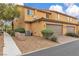 Charming two-story townhome featuring an attached garage and low maintenance desert landscaping at 2376 Via Firenze, Henderson, NV 89044