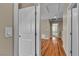 Upstairs hallway with solid flooring and views of bedrooms and stairs at 2376 Via Firenze, Henderson, NV 89044
