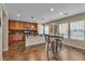 Eat-in kitchen area with bar seating and a modern lighting fixture over the counter at 2376 Via Firenze, Henderson, NV 89044
