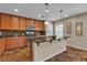 Charming kitchen featuring wood cabinets, granite countertops, and stainless steel appliances at 2376 Via Firenze, Henderson, NV 89044