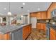 Open concept kitchen with an island and stainless steel appliances at 2376 Via Firenze, Henderson, NV 89044