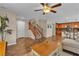 Spacious living room with tiled floors, stairs, and bar seating with kitchen view at 2376 Via Firenze, Henderson, NV 89044