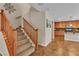 Carpeted staircase leading to the upper level, with natural light and stylish décor at 2376 Via Firenze, Henderson, NV 89044