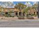 Charming townhome featuring desert landscaping, stone accents, and neutral color scheme at 2376 Via Firenze, Henderson, NV 89044
