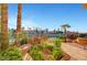 Lush backyard landscaping with flowering plants on a beautiful waterfront property at 2705 Crystal Beach Dr, Las Vegas, NV 89128
