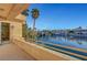 A balcony with lake views, palm trees, and a bridge at 2705 Crystal Beach Dr, Las Vegas, NV 89128