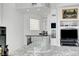 Chic mirrored bar area, with sleek black countertop, built-in shelves, and convenient serving space at 2705 Crystal Beach Dr, Las Vegas, NV 89128