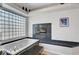 Bathroom featuring soaking tub, fireplace, and natural light from glass block window at 2705 Crystal Beach Dr, Las Vegas, NV 89128