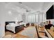 Bright bedroom featuring a ceiling fan, and two beds at 2705 Crystal Beach Dr, Las Vegas, NV 89128
