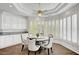 Cozy dining area with a tray ceiling, surrounded by bright windows at 2705 Crystal Beach Dr, Las Vegas, NV 89128