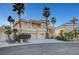 Beautiful home showcasing a spacious three-car garage, meticulous landscaping, and a grand entrance at 2705 Crystal Beach Dr, Las Vegas, NV 89128