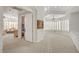 Hallway featuring neutral paint and carpet, artwork and access to rooms at 2705 Crystal Beach Dr, Las Vegas, NV 89128