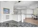 Bright kitchen featuring a breakfast bar, white cabinetry, recessed lighting, and modern appliances at 2705 Crystal Beach Dr, Las Vegas, NV 89128