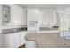 Modern kitchen with white cabinets, granite countertops, and stainless steel microwave and oven at 2705 Crystal Beach Dr, Las Vegas, NV 89128