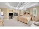 This main bedroom features soft carpeting, a fireplace, and refined décor at 2705 Crystal Beach Dr, Las Vegas, NV 89128