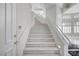 Carpeted staircase with white risers and handrails leads to open living space at 2705 Crystal Beach Dr, Las Vegas, NV 89128