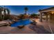 Resort-style backyard with a custom pool, waterfall, and lush landscaping at 2764 Kilwinning Dr, Henderson, NV 89044
