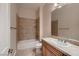 Bright bathroom featuring a bathtub, sink with a vanity, and tile floors at 2764 Kilwinning Dr, Henderson, NV 89044
