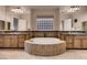 Main bathroom features a large soaking tub, double sinks, and a privacy window at 2764 Kilwinning Dr, Henderson, NV 89044