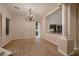 Formal dining area with a chandelier, neutral tones, and a view of the kitchen at 2764 Kilwinning Dr, Henderson, NV 89044