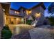 Elegant home featuring a private second-story balcony, covered parking, and mature landscaping at 2764 Kilwinning Dr, Henderson, NV 89044