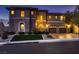 Beautiful two-story home with stone accents, a well-manicured lawn, and three-car garage at 2764 Kilwinning Dr, Henderson, NV 89044