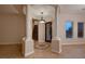 Grand foyer features decorative tile, a staircase, and beautiful pillars around the front door at 2764 Kilwinning Dr, Henderson, NV 89044