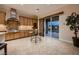 Modern kitchen with backyard views, lots of cabinets, stainless appliances, and tile backsplash at 2764 Kilwinning Dr, Henderson, NV 89044