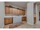 Functional laundry room equipped with cabinetry, a sink, countertop space, and a washer and dryer at 2764 Kilwinning Dr, Henderson, NV 89044