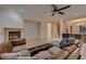Cozy living room with a fireplace, comfortable furniture, and an open layout at 2764 Kilwinning Dr, Henderson, NV 89044