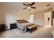 Comfortable main bedroom with neutral tones, a ceiling fan, and an ensuite bathroom at 2764 Kilwinning Dr, Henderson, NV 89044