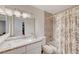 Cozy bathroom featuring a shower-tub combination and marble-patterned shower curtain at 2914 Luminous Ct, North Las Vegas, NV 89032