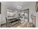 Open concept dining room featuring modern lighting and seamless flow into the kitchen at 2914 Luminous Ct, North Las Vegas, NV 89032