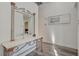 Entryway featuring modern flooring, table, mirror and access to the home at 2914 Luminous Ct, North Las Vegas, NV 89032