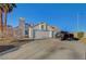 Charming single-story home featuring a three-car garage and well-maintained front yard at 2914 Luminous Ct, North Las Vegas, NV 89032