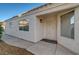 Welcoming home featuring a secure front door, stucco exterior, and neatly kept landscaping at 2914 Luminous Ct, North Las Vegas, NV 89032
