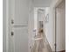 Hallway featuring cabinetry, modern flooring and access to the bedrooms and other living spaces at 2914 Luminous Ct, North Las Vegas, NV 89032
