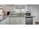 Kitchen features white cabinetry, granite counters and stainless steel appliances at 2914 Luminous Ct, North Las Vegas, NV 89032