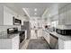 Modern kitchen boasts stainless steel appliances, granite countertops, and a functional layout at 2914 Luminous Ct, North Las Vegas, NV 89032