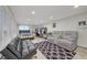 Open living room with tile flooring, recessed lighting, and a comfortable seating area at 2914 Luminous Ct, North Las Vegas, NV 89032