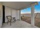Covered patio shows a chair and table, ideal for relaxing, with a low-maintenance landscape visible at 2914 Luminous Ct, North Las Vegas, NV 89032