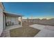 This covered patio area overlooks a well-maintained gravel yard, complemented by a concrete path at 2914 Luminous Ct, North Las Vegas, NV 89032