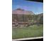 Lush backyard with mature trees and decorative pots at 3609 Citrus Heights Ave, North Las Vegas, NV 89081