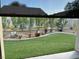 This backyard features a well-maintained lawn and desert landscaping for relaxed outdoor living at 3609 Citrus Heights Ave, North Las Vegas, NV 89081